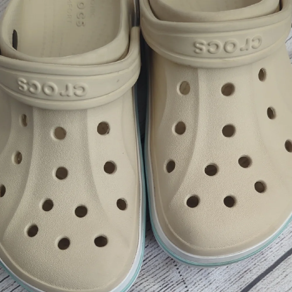 CROCS Kids Classic Clog in Cream with Light Blue Trim